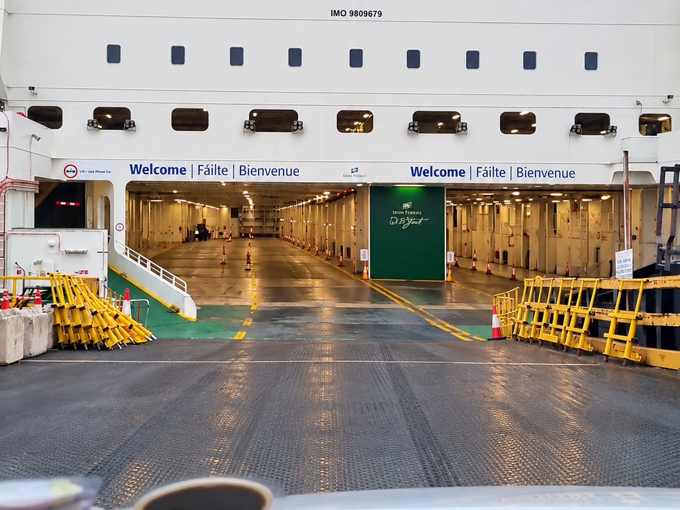 Driving onto the vehicle deck of the Irish Ferries W.B. Yeats at Dublin Port, under a Welcome / Failte / Bienvenue sign